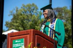 Image of Caprecia Miller speaking to the 2021 and 2020 graduating classes.