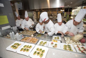 chefs making appetizers