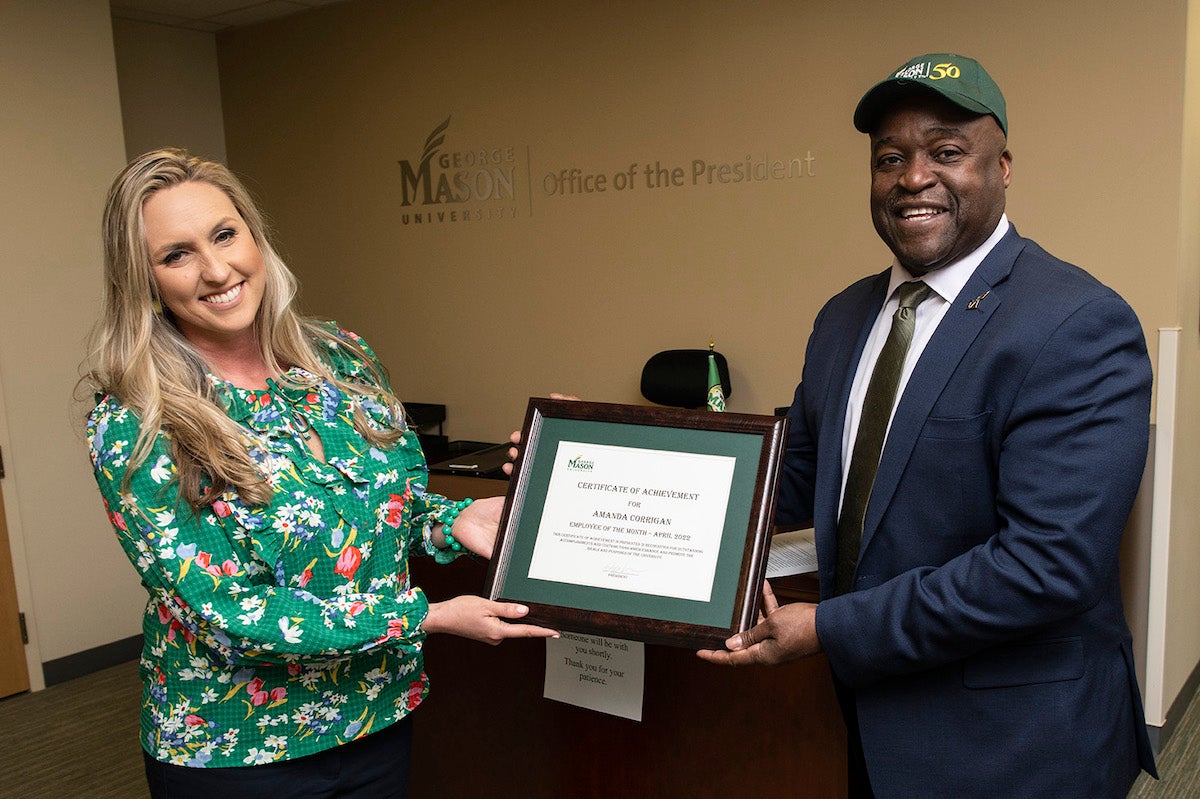 woman with man holding a plaque