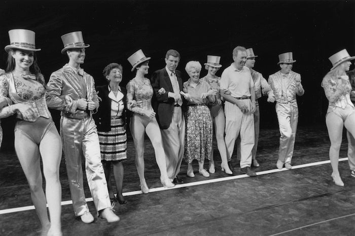 b and w of people on stage