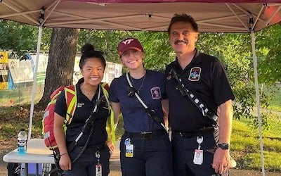 a group of EMTs outside with equipment