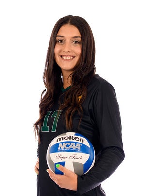 young woman holding a volleyball