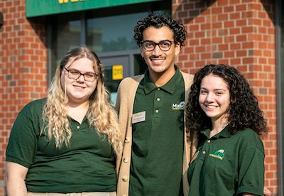 Mason Ambassadors pose in front of the Visitors Center