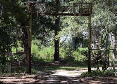 photo of a gate in the woods
