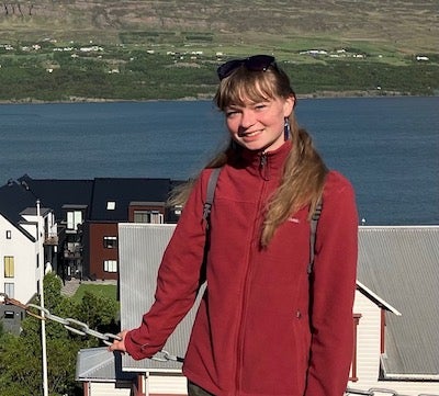 woman in red jacket pictured in Iceland