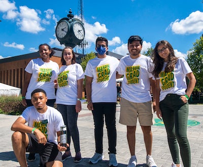group of grad students by the clock