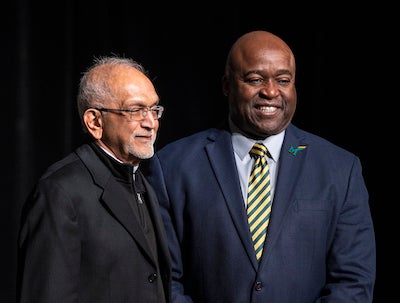 two men on stage at U Day