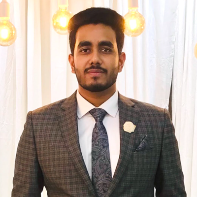 Ahnaf Atef Choudhury, IST PhD student at Mason, wears a gray, plaid suit and blue tie in his profile.