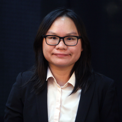 Pattiya Mahapasuthanon, IST PhD student at Mason, wears a black blazer, beige shirt, and glasses in her profile.