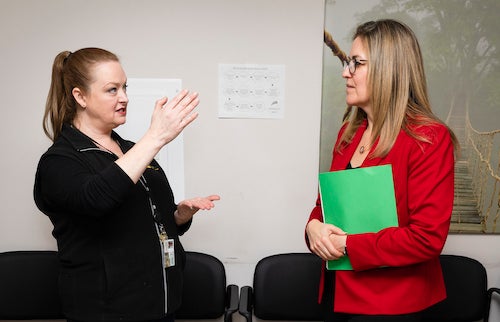 Mason faculty member Rebecca Sutter (left) talking with Representative Jennifer Wexton