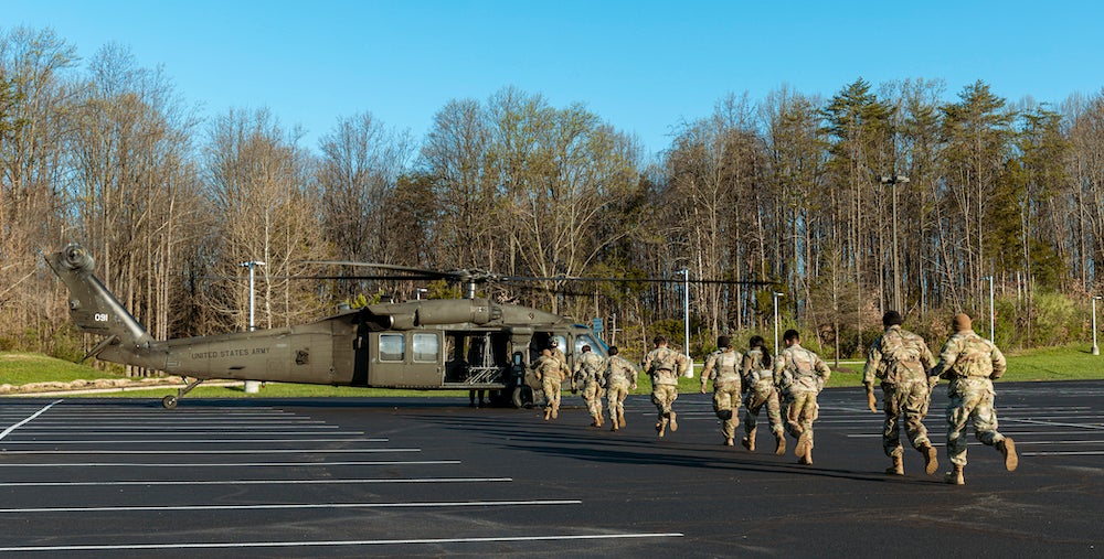 ROTC students getting on the Black Hawk helicopters