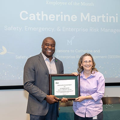 President Gregory Washington with Employee of the Month Catherine Martini