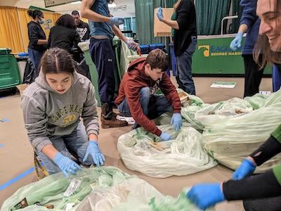 students sorting trash
