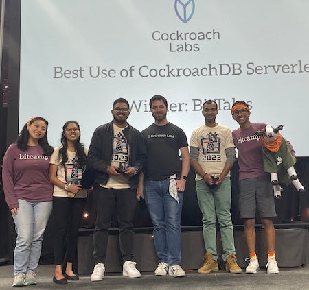 team posing after winning