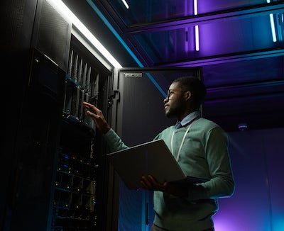 stock photo of man in a data center