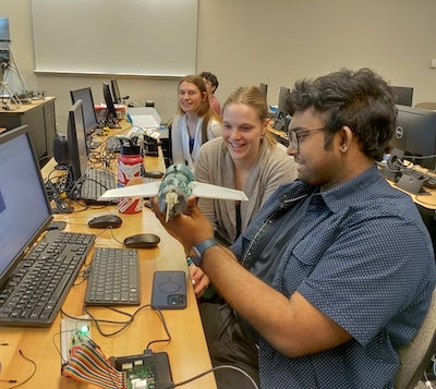 students working with tech