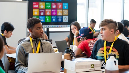 students talking at a table