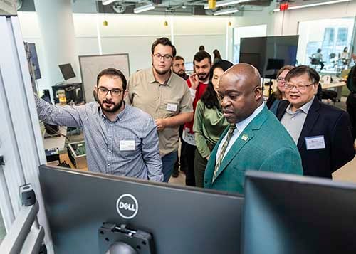 Guests at Fuse Topping Out visit student demonstrations.