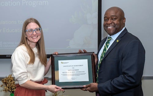 Katie Richards and George Mason President Gregory Washington during the November Employee of the Month ceremony