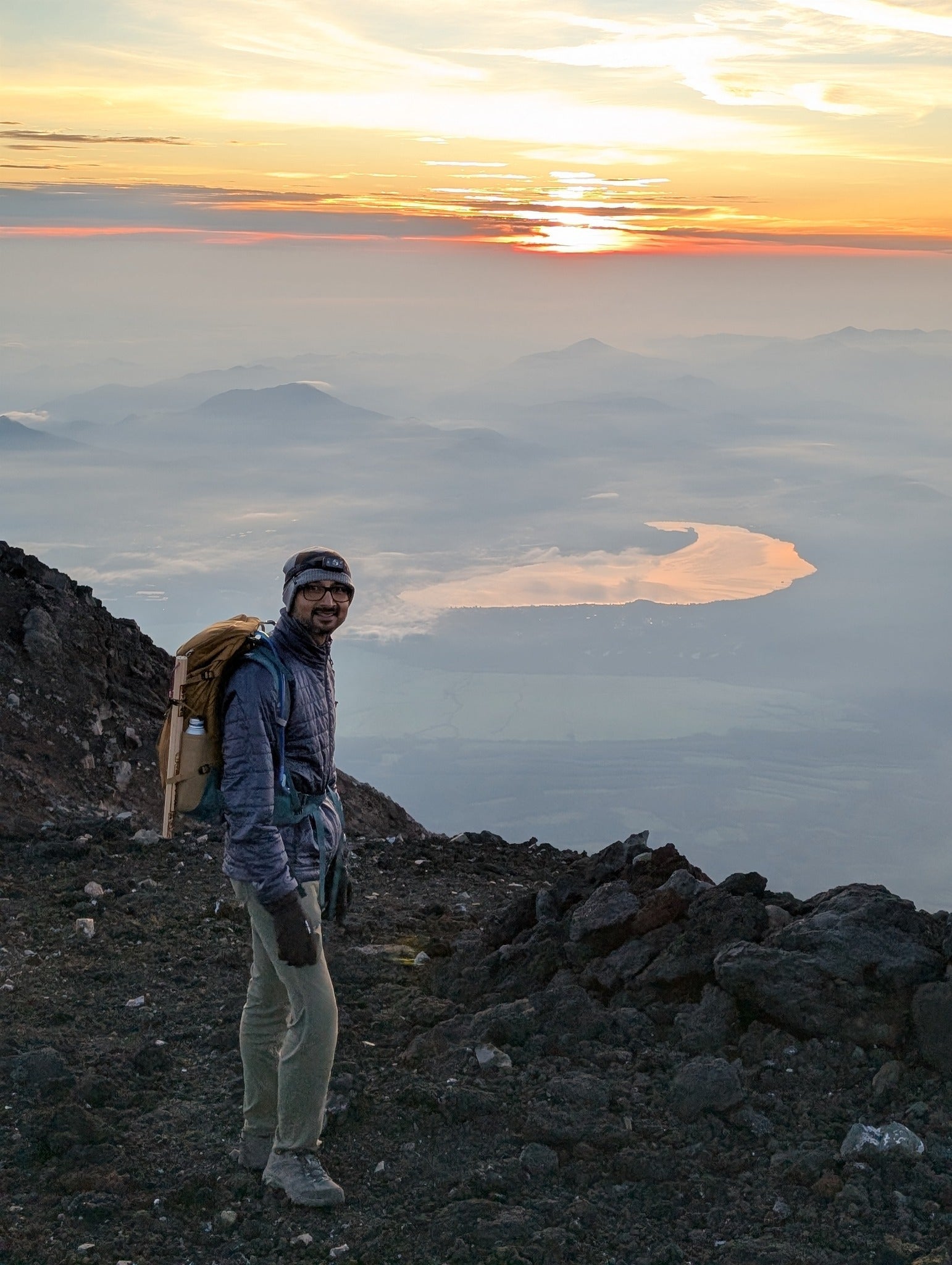 Pallab Sanyal hiking the summit of Mount Fuji in Japan.