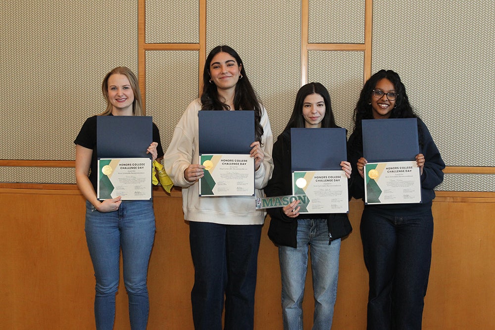 Winning team poses with their award certificates for "Most Actionable Recommendation"