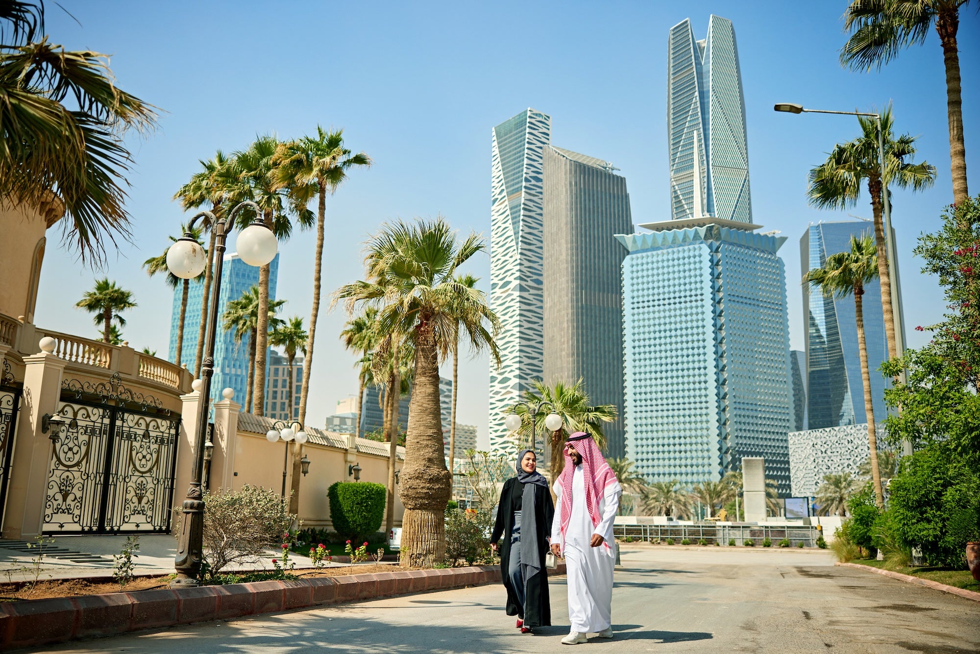 A man and a woman walking in Saudi Arabia. Photo provided by iStock.