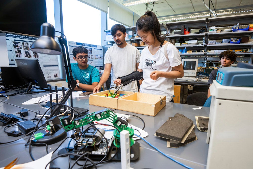 BioE Buzz summer campers learn about bioengineering by testing exoskeletons and biomechanics while interacting with George Mason faculty and students.