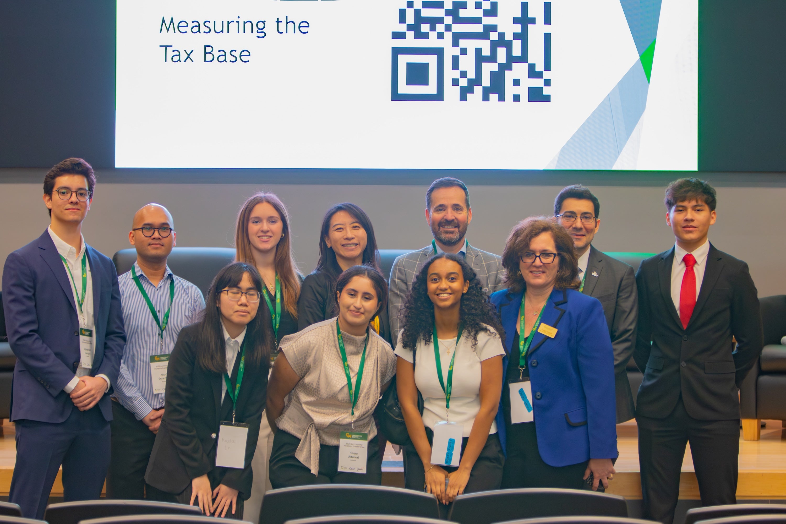 Costello College of Business accounting students alongside Long Chen, Area Chair and professor of accounting (top row, center) and Peggy Tsirigotis, senior instructor of accounting and assistant area chair (bottom row, far right). Photo by Hannah Patterson/Costello College of Business.