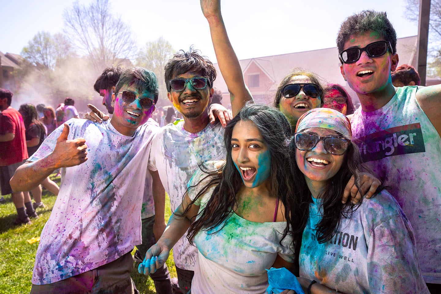 Students are covered in colorful powder at the Holi Moli event