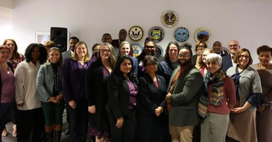 Several people who are part of an Office of Personnel Management program are in a group photo