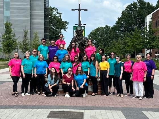 MCAA faculty, staff, and students on the Roger Wilkins Plaza. Photo by Beth Anne Young.