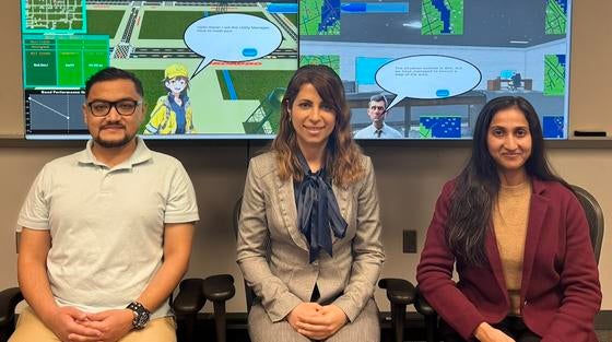 Shima and team with game graphics