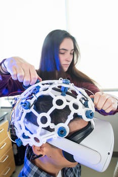 Image of person with a VR helmet set on. 