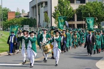 Class of 2022 procession on the Fairfax Campus during Spring Commencement ceremony.