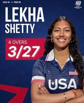 Woman in a USA team jersey standing against a dark backdrop