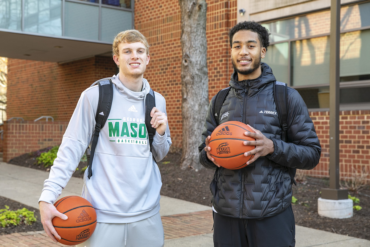 Mason men's basketball players, Blake Buchanan, left, and D'Shawn Schwartz