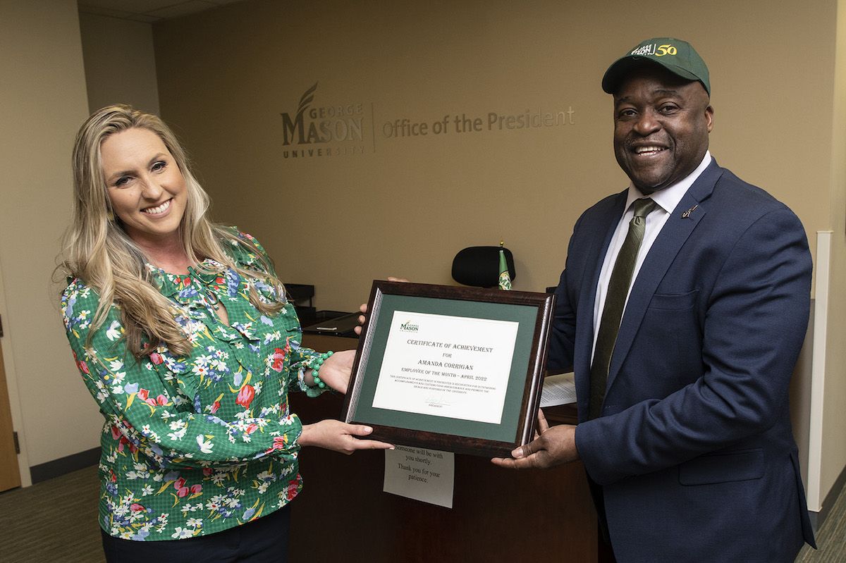 woman with man holding a plaque