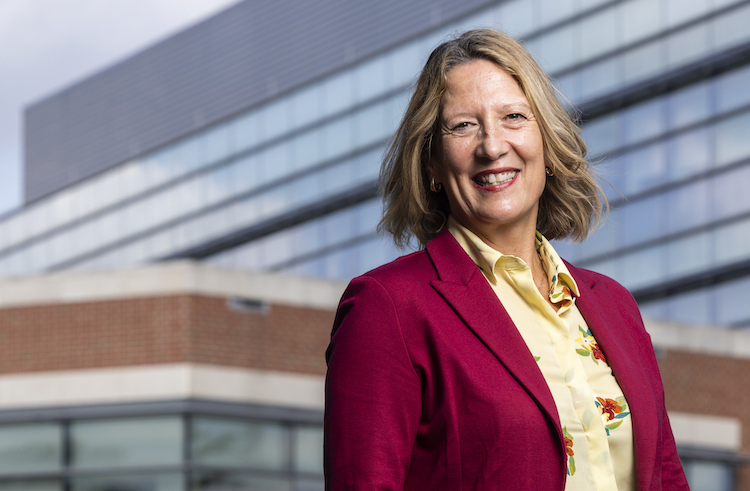 woman posing outside of building
