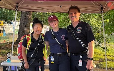 a group of EMTs outside with equipment