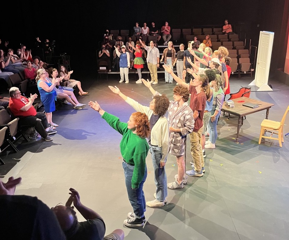 students performing before an audience