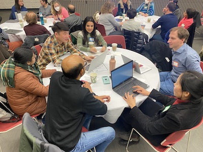 people at round table talking