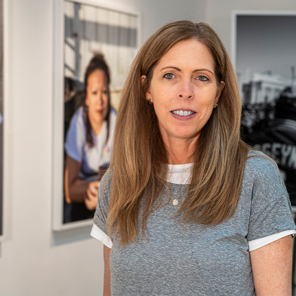Sisc Johnson in front of some of her photography. Photo by Cristian Torres.