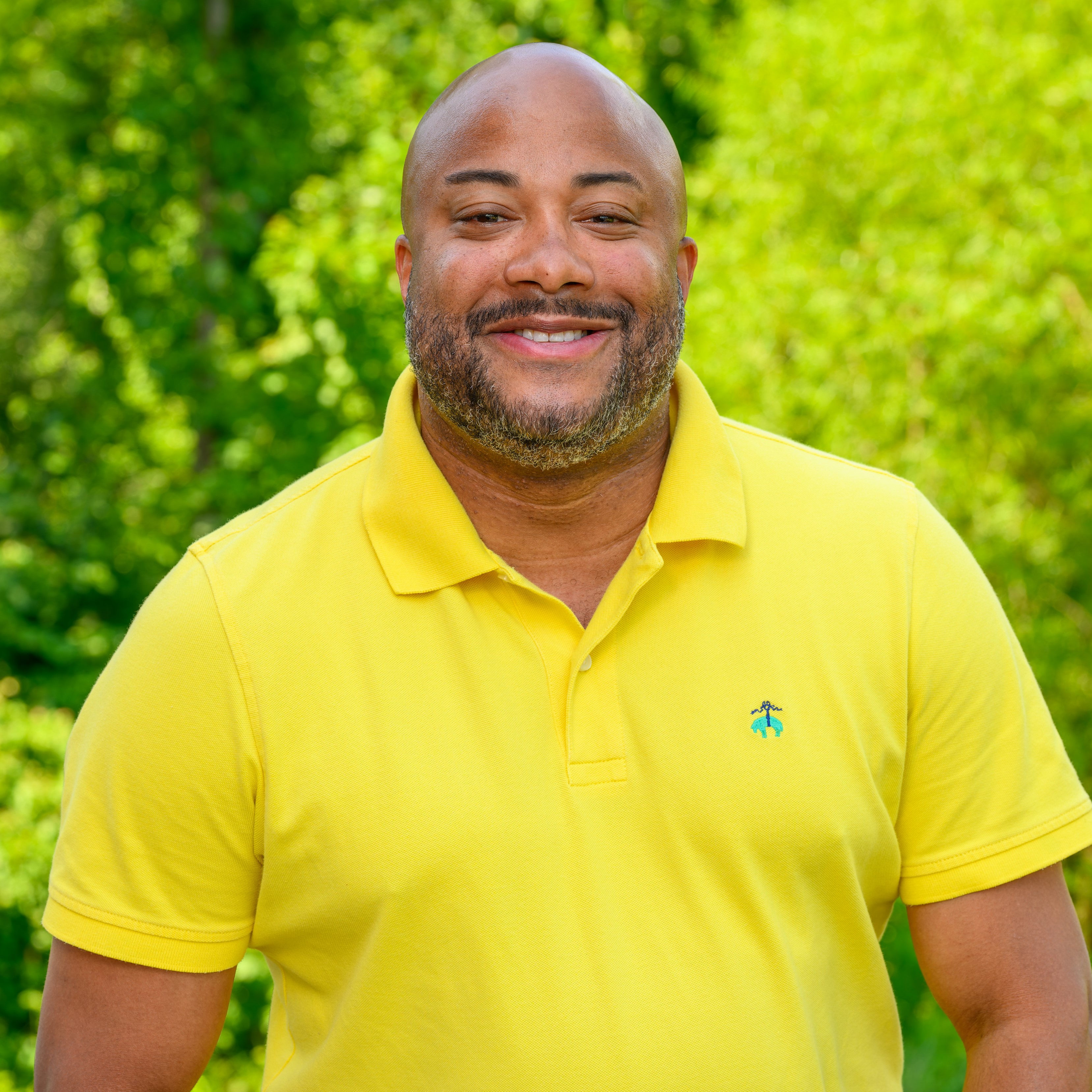Jermaine Taylor in a yellow polo smiling