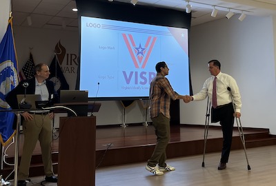 mason student receiving a challenge coin