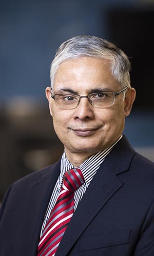 Man in blue blazer with striped tie