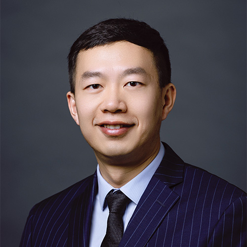 Zhicong Lu in a dark blue suit and tie