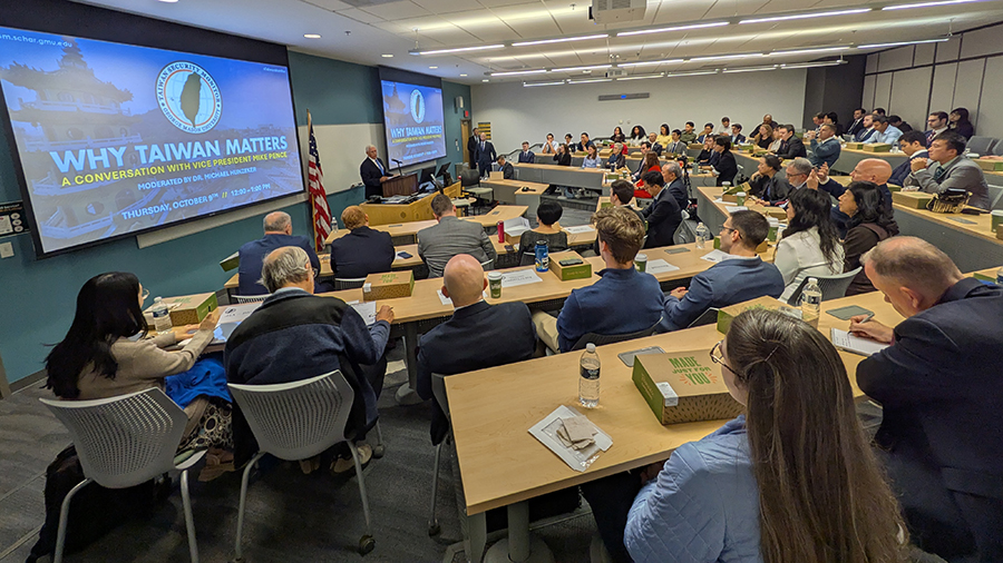 A wide view of the Schar School lecture hall shows Vice President Mike Pence speaking at the front while a packed audience of students, faculty, and guests listens during the “Why Taiwan Matters” discussion.