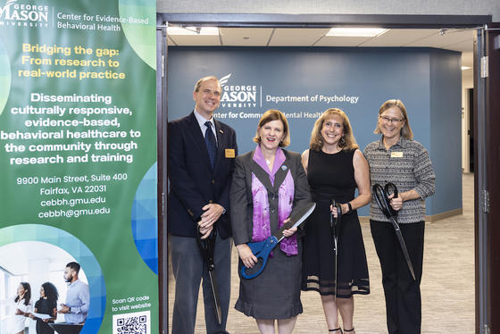 four people with scissors