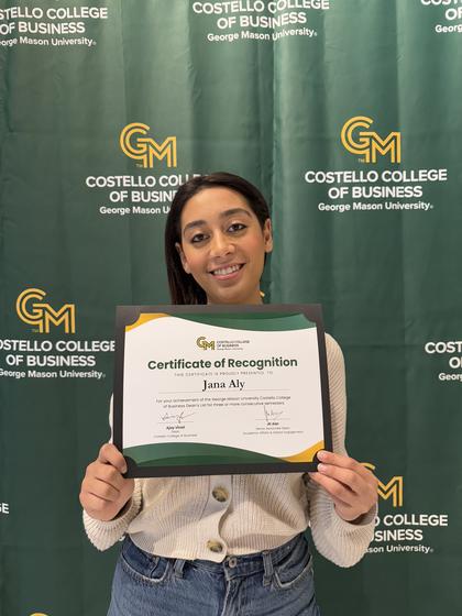 Jana Aly holding her Certificate of Recognition