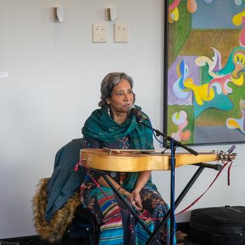 Lap-steel slide guitarist, Pure Fé, performs for George Mason University students.